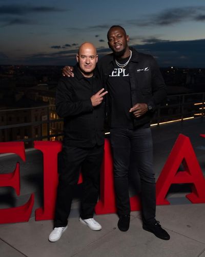 Unparalleled Style and Solidarity: Usain Bolt and Friend Strike Pose