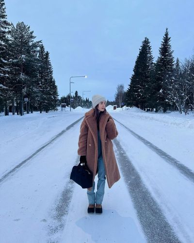 Lily Collins Embraces Wintry Wonderland in Snowy Vacation Snapshots