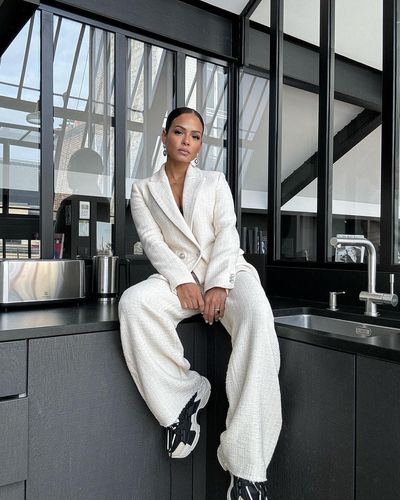 Christina Milian Shines in Chic White Outfit and Elegant Pose