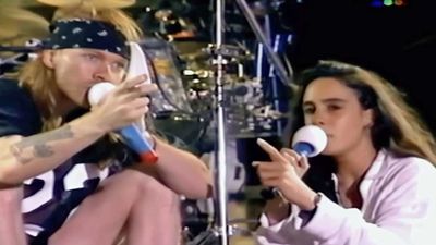 "If you see anyone throwing things, beat them up": Watch Axl Rose berate a crowd in Argentina via his translator in 1992