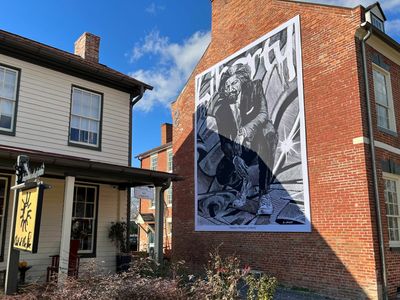 A Frederick Douglass mural in his hometown in Maryland draws some divisions