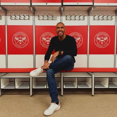 Stylish Camaraderie: Stan Collymore and Friend's Playful Connection