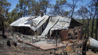 Third home lost in bushfire, residents return to ruins