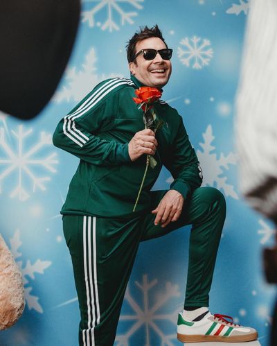 Bold Green Track Suit, Cool Sunglasses, Whimsical Rose: Jimmy's Style Statement