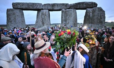 ‘A time to reflect’: crowds celebrate winter solstice at Stonehenge