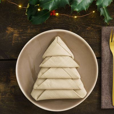 How to fold a serviette into a Christmas tree and take your festive tablescaping up a notch