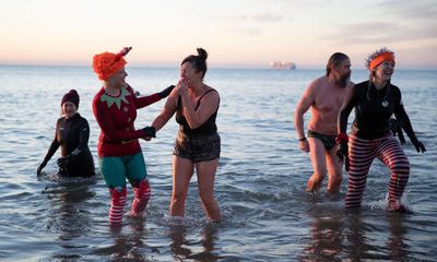 ‘Christmas stink’: UK’s traditional festive swims face rising tide of sewage