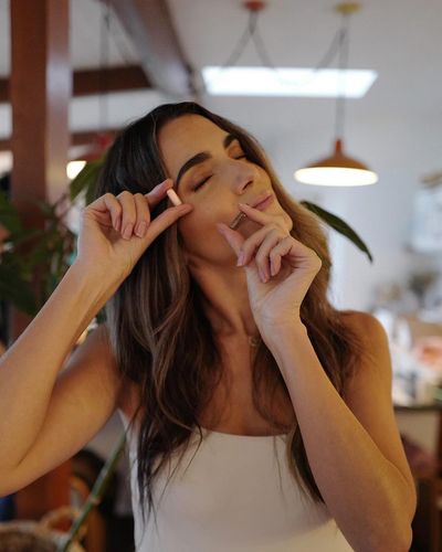 Nikki Reed: Elegance and Tech-savvy Charm in Graceful Pose