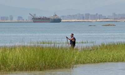 Escaping Xi’s China by paddleboard: ‘I rushed into the water and thought if they catch me, they catch me’