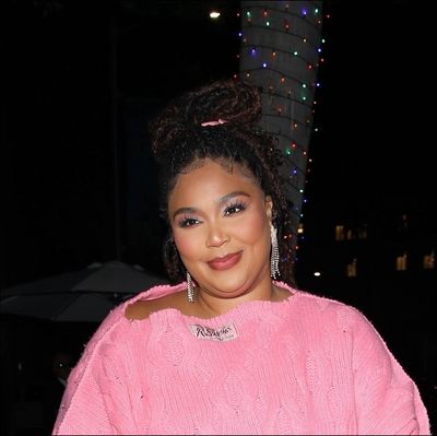 Lizzo Reaches Inspiring Levels Of Cozy In A Blanket-Like Sweater Dress