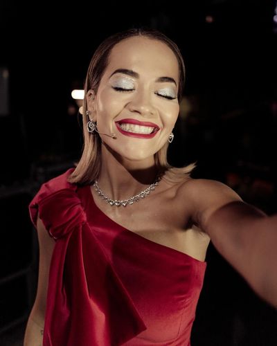 Rita Ora Radiates Confidence in Stunning Red Dress and Smile
