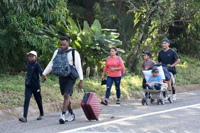 Migrant caravan in southern Mexico marks Christmas Day by trudging onward