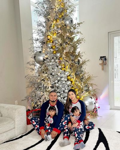 Radiant Family's Joyful Christmas Celebration Filled with Love and Warmth