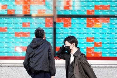Stock market today: Asian markets advance in holiday-thinned trading but Chinese shares slip