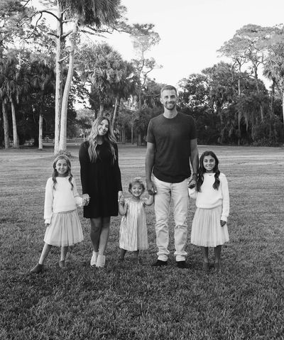 Steve Cishek's Festive Christmas Greeting with Family in Monochrome Photo