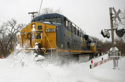 Blizzard blankets plains, flash floods threaten east coast