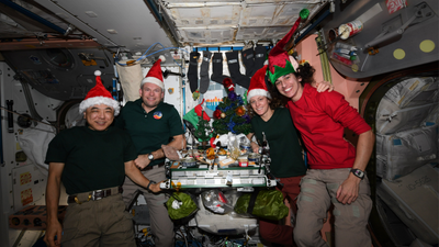 International Space Station astronauts hang stockings and light a menorah for the holidays (images, video)