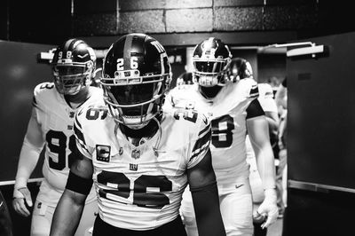 Saquon Barkley and teammates rock black and white football gear