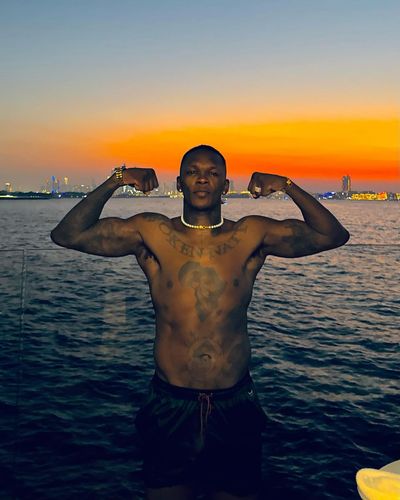 Israel Adesanya Enjoying Beach Time with Friends and Beautiful Sunsets