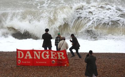 Danger-to-life weather warning as walkers seen photographing waves behind huge advice sign