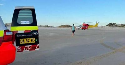 Group of swimmers stuck in rip, woman flown to Newcastle hospital