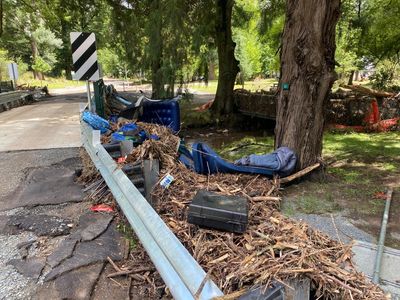 ‘Roaring like the ocean’: campers survey aftermath of Victorian flash flood that left two dead