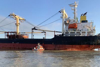 A cargo ship picking up Ukrainian grain hits a Russian floating mine in the Black Sea, officials say