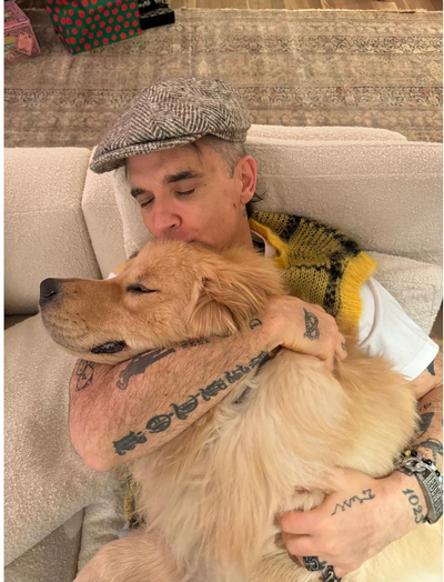 Robbie Williams and His Adorable Furry Sidekick: A Heartwarming Duo