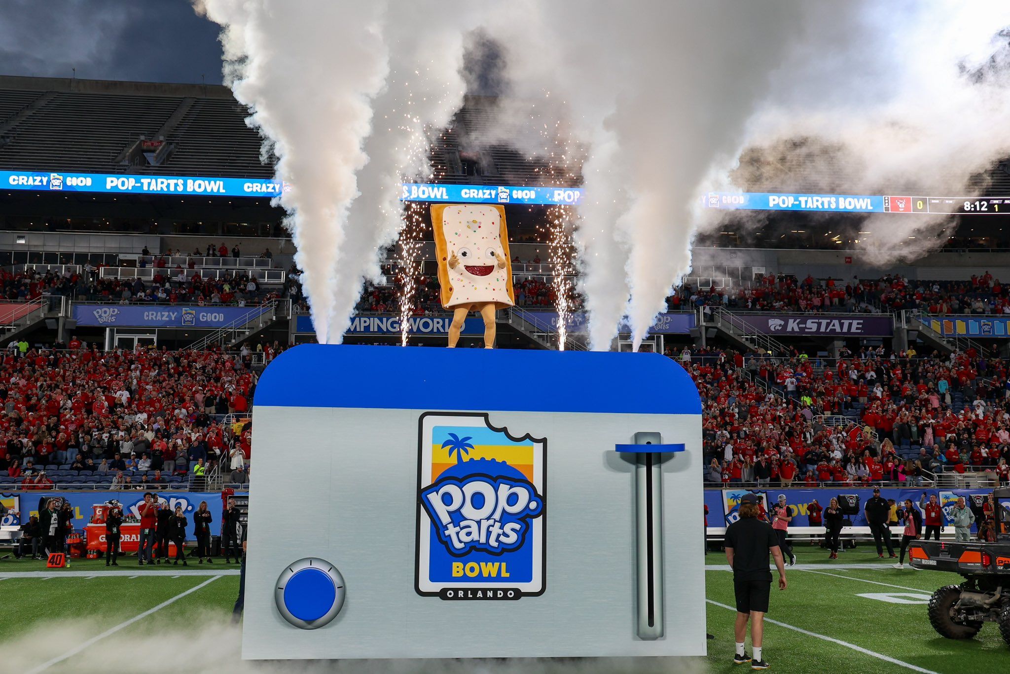 The PopTarts Bowl (nonedible) mascot popped out of a…