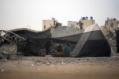 Displaced Palestinians flood a southern Gaza town as Israel expands its offensive in the center