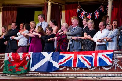 Why do we hold hands as we sing Auld Lang Syne on New Year's Eve?