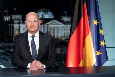 In a crisis-ridden world, Germany's chancellor uses his New Year's speech to convey confidence