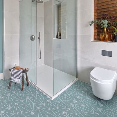 A genius layout solution makes a freestanding bath the star of this luxe bathroom makeover