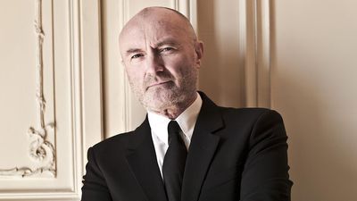 Phil Collins' Stylish Suit Serenade: A Display of Elegance and Charm