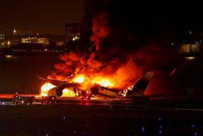 Fire destroys jet after collision in Tokyo