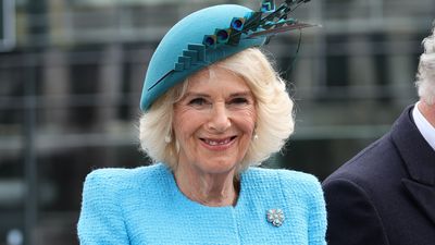 Queen Camilla's final look of 2023 was an ice blue vision with the perfect rainy January accessory