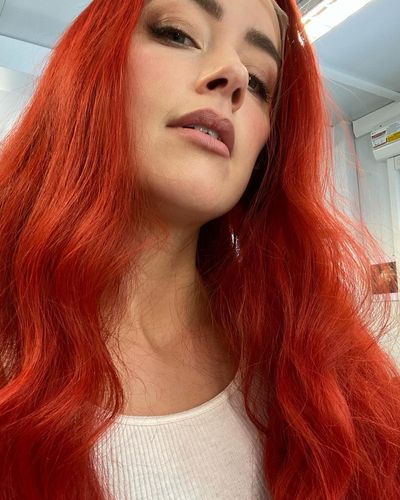 Amber Heard's Captivating Photoshoot Showcases Stunning Crimson Locks