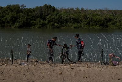 Biden administration battles Texas over razor wire on border
