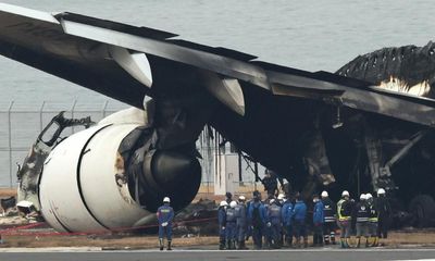 Japan Airlines pilots in Tokyo plane crash had to be told of fire by cabin crew – report