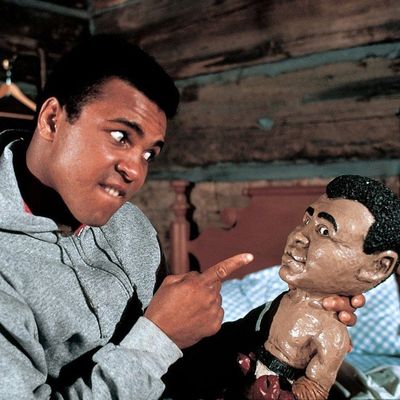 Muhammad Ali and the Legendary Doll: A Captivating Photo Shoot