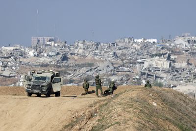Israeli troops have withdrawn from some parts of Gaza City, a city official says