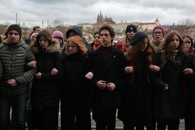 Students march in Prague to honor the victims of the worst mass killing in Czech history