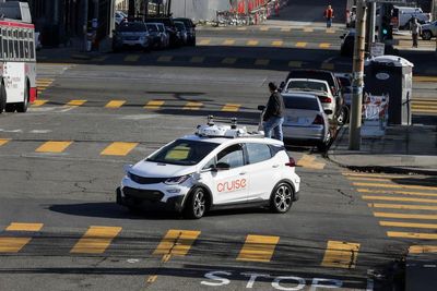 Why are self-driving cars exempt from traffic tickets in San Francisco?