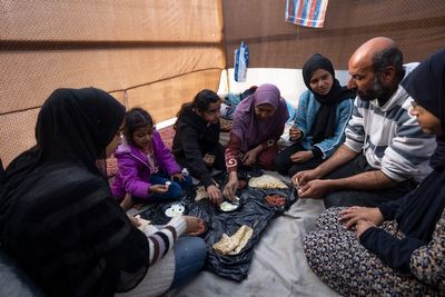 Families in Gaza search desperately for food and water, wait in long lines for aid