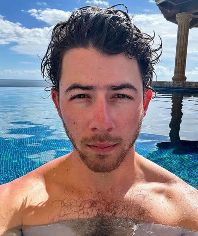 Nick Jonas Welcomes 2024 with Poolside Style and Confidence