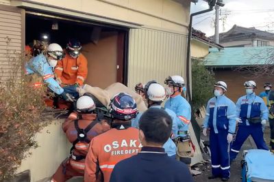 Survivors are found in homes smashed by Japan quake that killed 94 people. Dozens are still missing