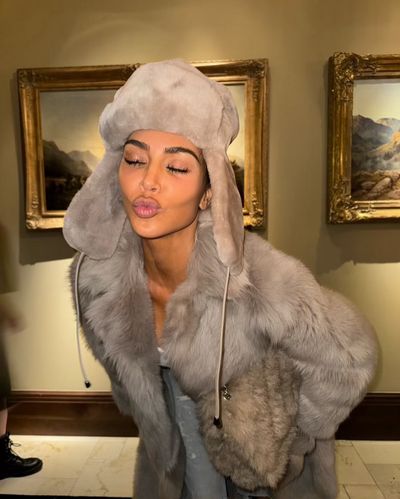 Kim Kardashian's Winter Chic Style Complemented by Artful Backdrop