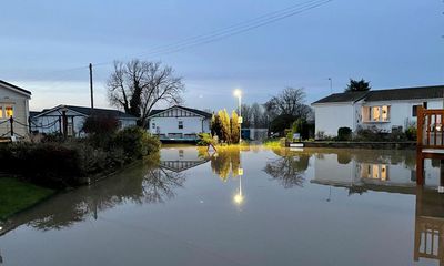 Cold weather alert issued after homes flooded and transport network hit across England and Wales – as it happened