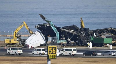 Japanese air safety experts search for voice data from plane debris after runway collision