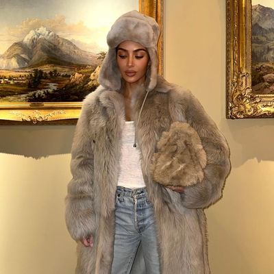Kim Kardashian Embraces Loud Luxury in a Fur Coat, Hat, and Handbag